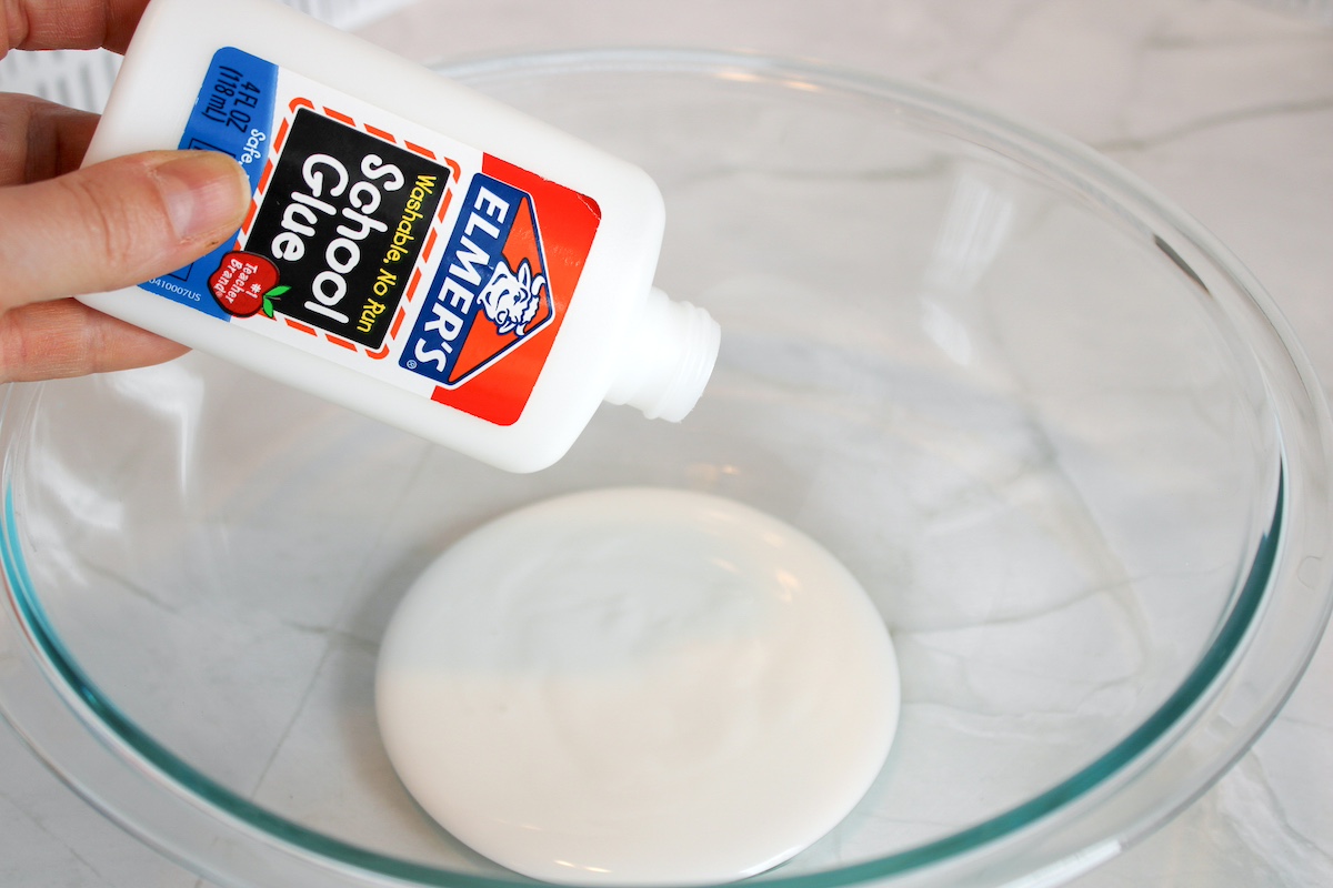 Adding white glue to a glass bowl