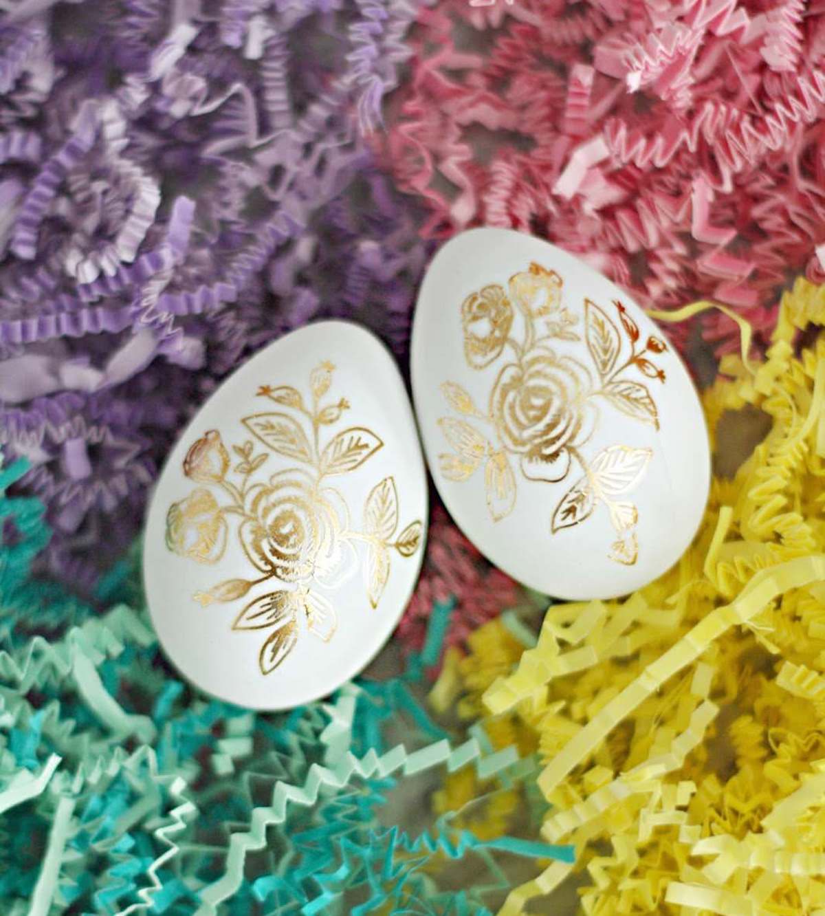 Easter eggs with tattoos on paper shreds