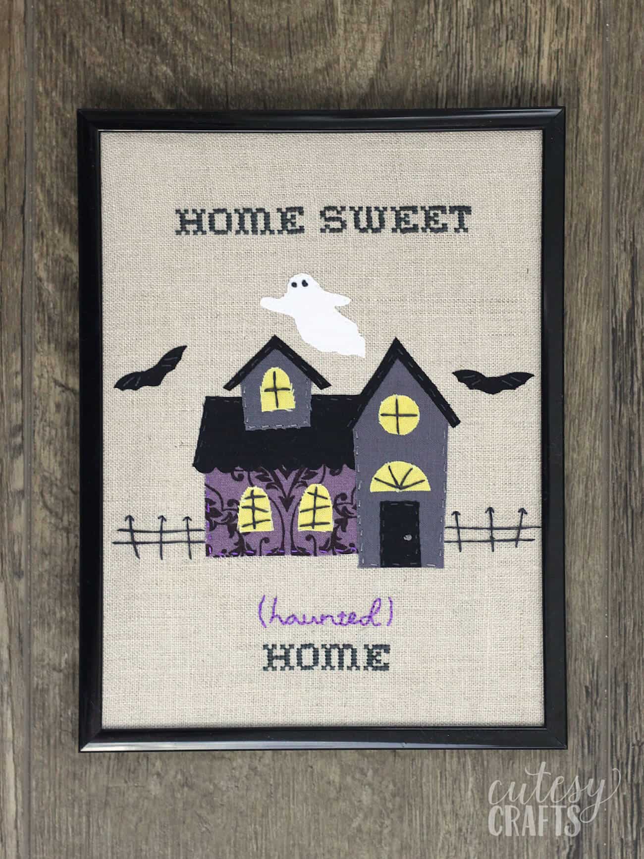 haunted mansion embroidery in a frame