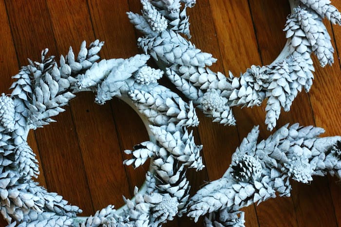 pine cones on wreath forms painted white