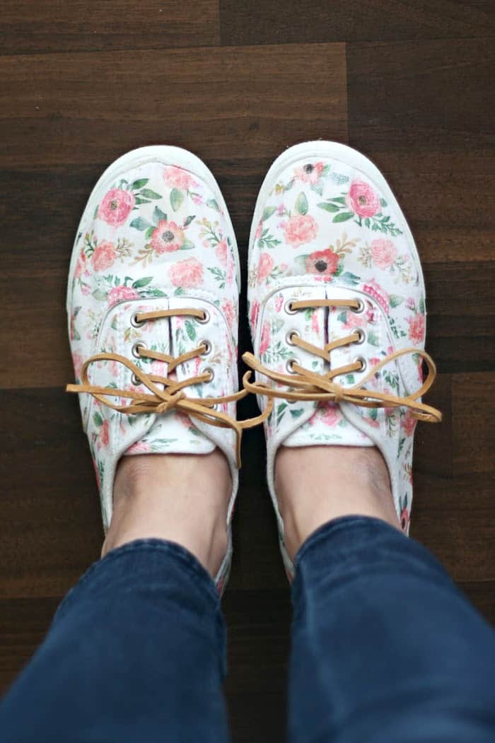 Woman wearing decorated canvas shoes