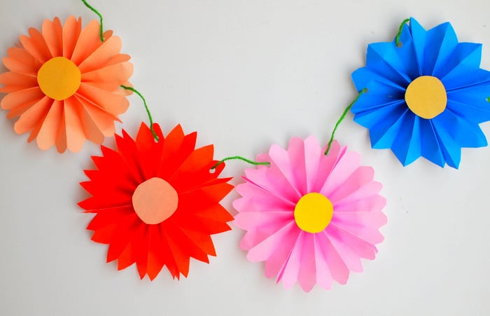 Paper flower banner hanging on the wall