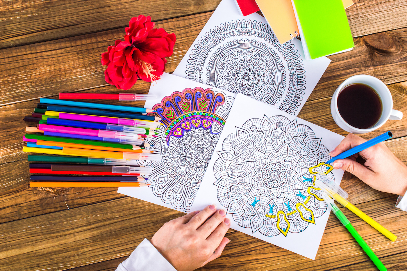 Woman-coloring-a-page-in-with-markers